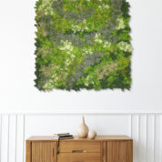Wooden sideboard table with books and a vase